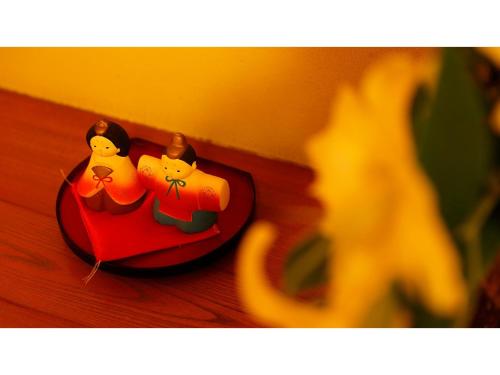 two miniature candles are sitting on a table at Mikuma Hotel - Vacation STAY 63475v in Hita