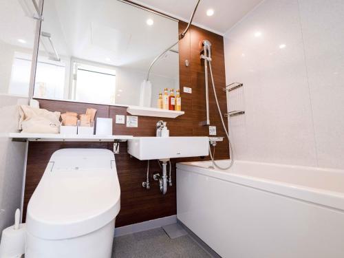 a bathroom with a toilet and a sink and a tub at Ashigarashimogun - Glamping - Vacation STAY 64129v in Sengokuhara