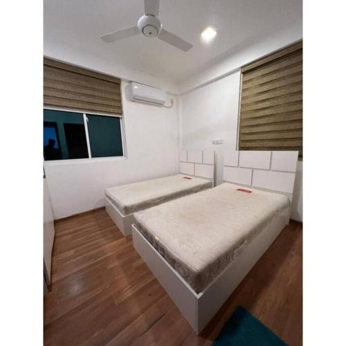 A bed or beds in a room at Ocean Apartments Hulhumale (Lot 10819)