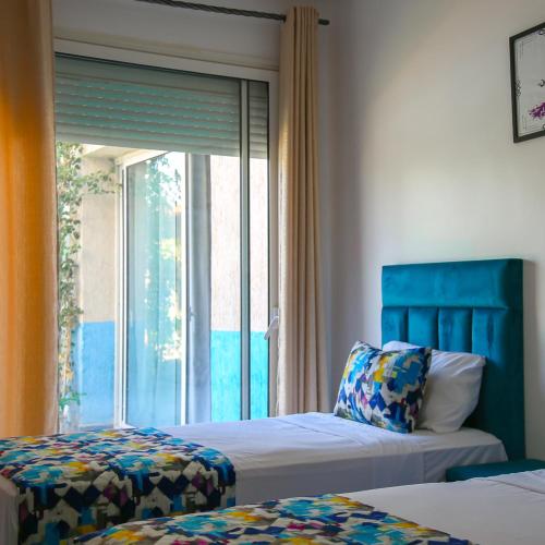 Postel nebo postele na pokoji v ubytování Hotel Jnane riad