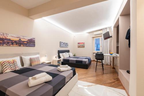 - une chambre avec un lit et un salon dans l'établissement Le stanze sui musei vaticani, à Rome