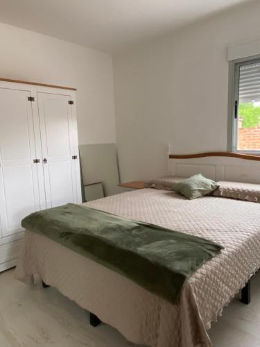 a bedroom with two beds and a window at La Mia Casa in Florida