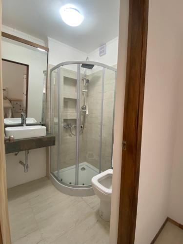 a bathroom with a shower and a toilet and a sink at La Mia Casa in Florida