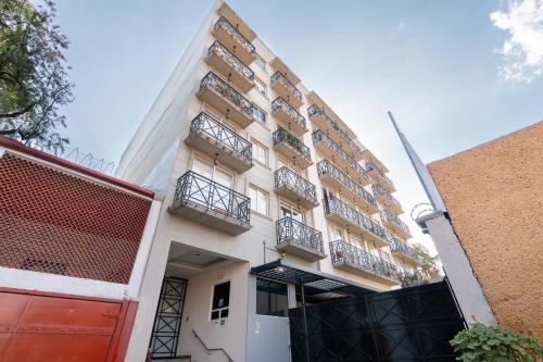 a building with balconies on the side of it at DEPARTAMENTO COMPLETO COYOACAN in Mexico City