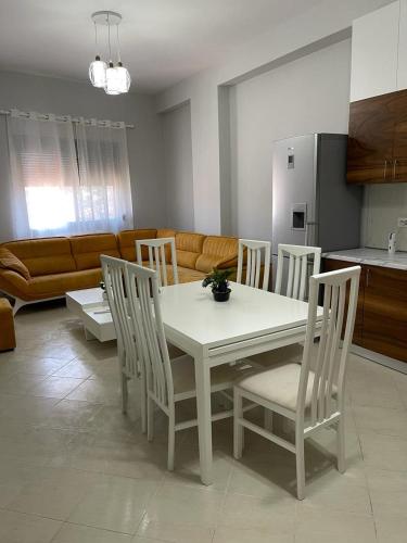 a white table and chairs in a living room at BB City Hall in Vlorë