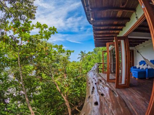 a view from the deck of a house with trees at Casa en la Playa Morro Paraiso in Palomino