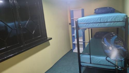 Postel nebo postele na pokoji v ubytování Hostal House 995