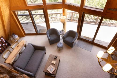 an overhead view of a living room with furniture and windows at Lazy Bear Lodge in Florissant with Mountain Views! in Florissant