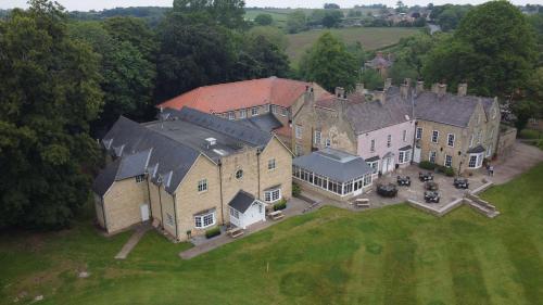 an aerial view of a large house with a yard at Hall Garth Hotel Darlington, Sure Hotel Collection by BW in Darlington