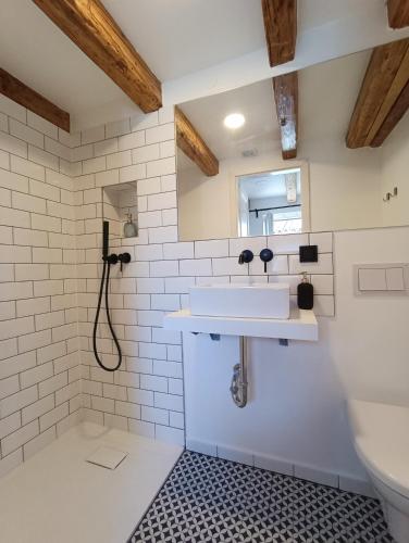 a bathroom with a sink and a mirror at M&R Apartments II in Koper