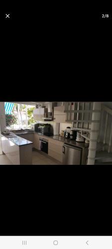 O bucătărie sau chicinetă la Duplex bord de mer