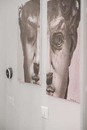 two paintings of a bust on a door at Major House - Luxury Apartments in Rome by Hostand in Rome