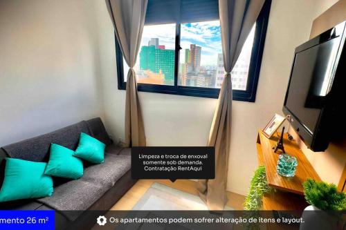 a living room with a couch and a window at 701- Rentaqui Comfort Liberdade Green in Sao Paulo