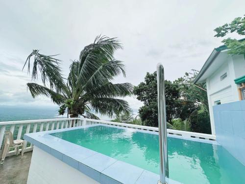 a swimming pool on the balcony of a house at Cabin de Paulin 2 in Tagaytay