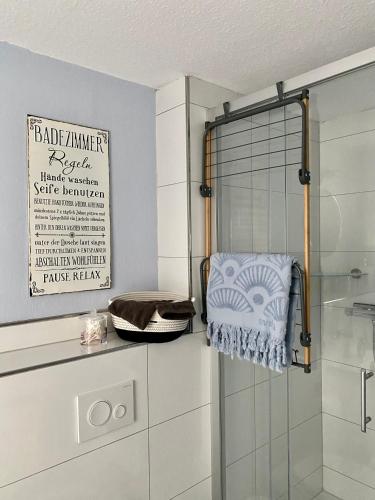 a bathroom with a shower with a towel on a rack at Ferienwohnung Elisabeth in Blankenhain