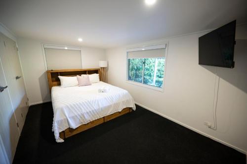 Een bed of bedden in een kamer bij Seaside Cottage on Fingal