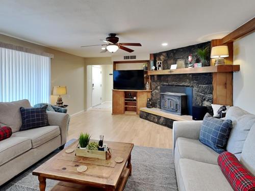 a living room with a couch and a fireplace at The Crows Nest in Ruidoso