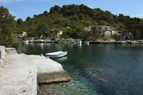 a boat is docked at a dock in the water at Apartments by the sea Okuklje, Mljet - 22340 in Maranovići