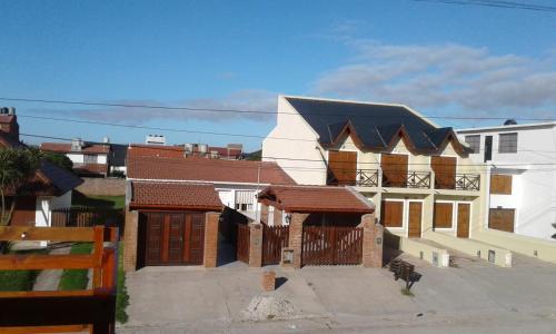 a large white building with a black roof at LA CASA DEL MAR in Santa Clara del Mar