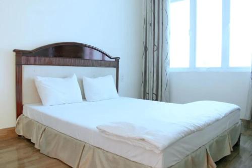 Ένα ή περισσότερα κρεβάτια σε δωμάτιο στο Amazon Hotel
