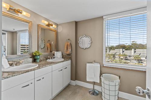 a bathroom with two sinks and a large mirror at North Hampton #331 in Myrtle Beach
