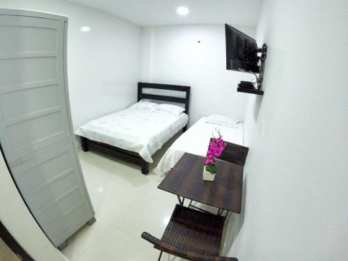 Cama o camas de una habitación en Hotel Almendros