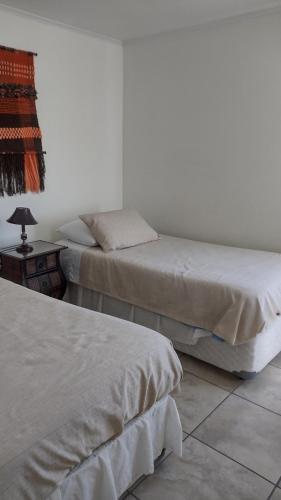 En eller flere senger på et rom på Pura vida, estilo Guest House NO departamento completo se arrienda por habitaciones