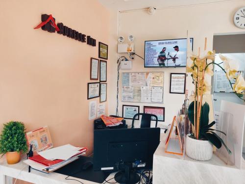 Télévision ou salle de divertissement dans l'établissement Aurelle Inn