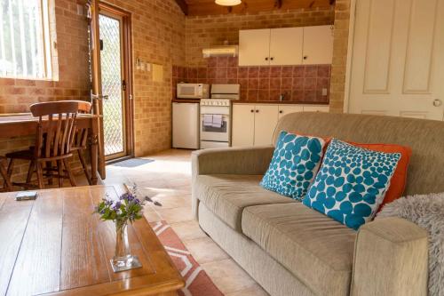 a living room with a couch and a table at Spring Bay Villas, Denmark, WA in Denmark