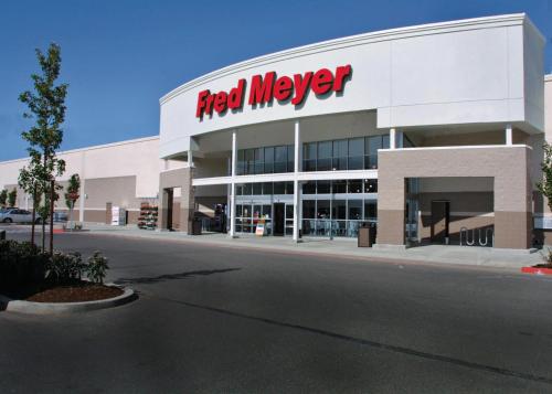 a red meyer sign on the side of a building at Burien's Top Unit with Spa-Inspired Bathroom in Burien