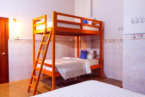 a bunk bed with two beds in a room at Le Tonle in Kratie