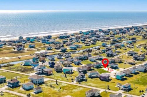 an aerial view of a resort next to the beach at Calypso Cove-3bd 2b-Sleeps up to 12 in Bolivar Peninsula