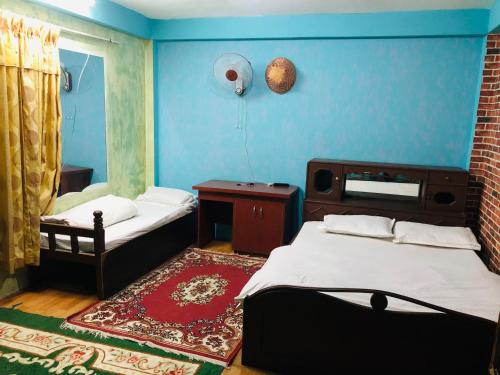 Postel nebo postele na pokoji v ubytování Sara's Backpackers Hotel