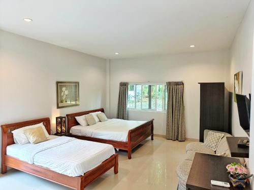 Katil atau katil-katil dalam bilik di Kong Garden Resort