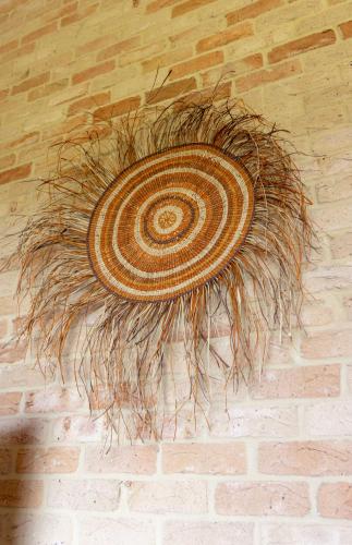 a large coil of grass on a brick wall at Spring Bay Villas, Denmark, WA in Denmark