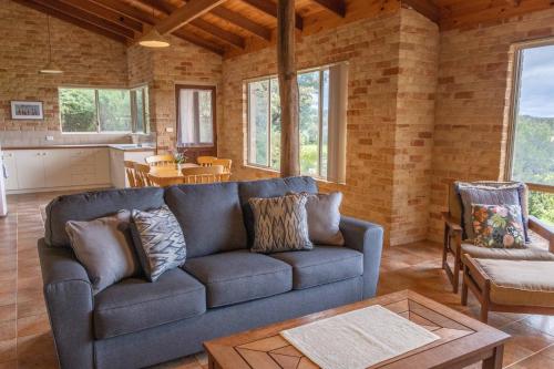 a living room with a couch and a table at Spring Bay Villas, Denmark, WA in Denmark