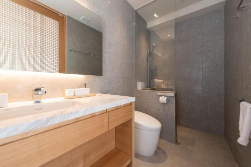 a bathroom with a sink and a toilet at Ro-An in Niseko