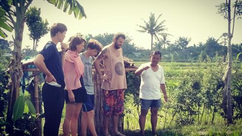 a group of people standing around in a field at Bujak Permai Villa Matahari Lombok NTB in Praya
