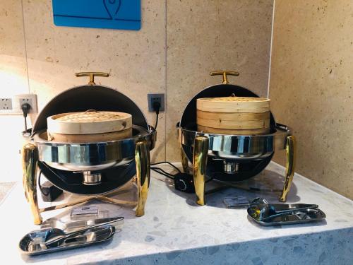 two drums sitting on top of a counter at Holiday Inn Express Chengdu North Railway Station by IHG - Near Panda Base, Near Chunxi Road in Chengdu