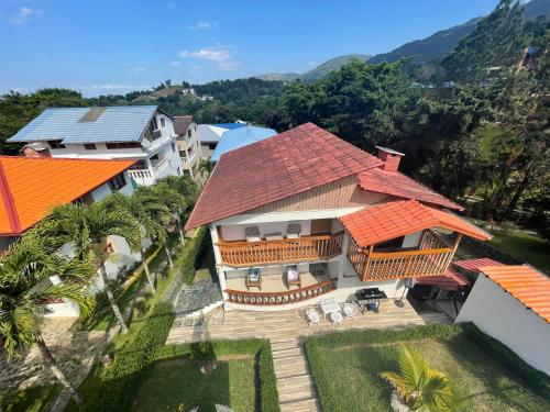 an aerial view of a house with an orange roof at Villa Channel in Jarabacoa