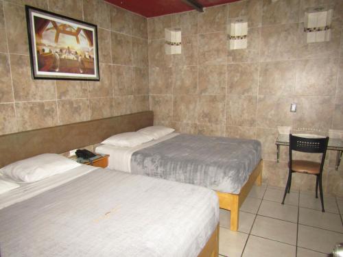 Cama o camas de una habitación en Hotel 1973