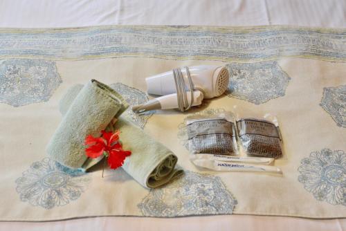a group of items on top of a bed at 広い庭付きBBQ可,残波ビーチまで車で5分,最大人数11名 Ns garden in Jima
