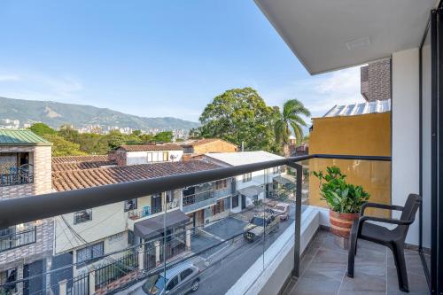 a balcony with a view of a city at MEDELLIN- Cerca al Poblado - 301 in Medellín