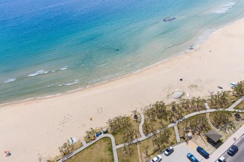 an overhead view of a beach with the ocean at Blue12 Yangyang Neos in Yangyang