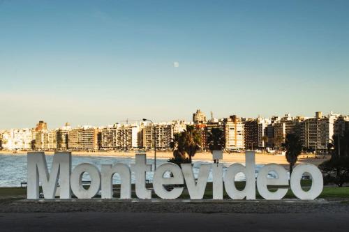 a sign for morocco in front of a beach at Home Sweet a mts Plaza Independencia in Montevideo