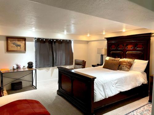 a bedroom with a large bed and a chair at Mountain View in Salt Lake City