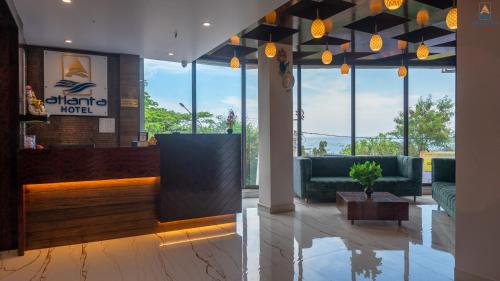 a lobby of a hotel with couches and a table at Hotel Atlanta - A Seaview Hotel in Port Blair