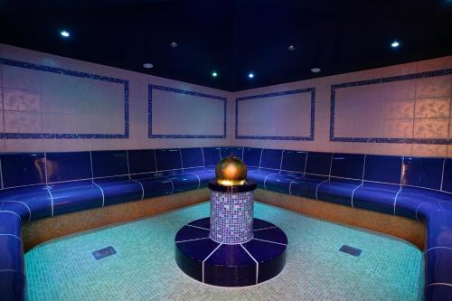 a room with a blue bar with a ball on top at Hotel Hochsauerland 2010 in Willingen