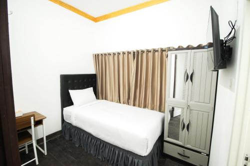 Postelja oz. postelje v sobi nastanitve DE Homestay Banjarmasin