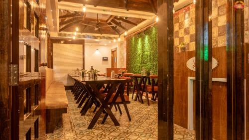 a dining room with a table and chairs at Hotel Atlanta - A Seaview Hotel in Port Blair